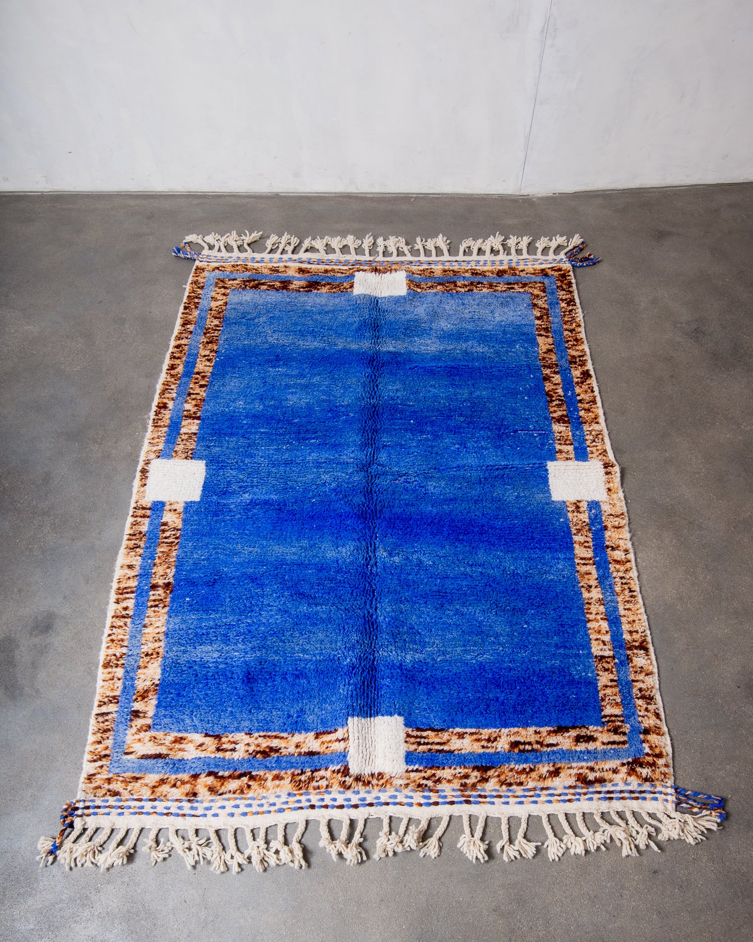 Modern, designer, handcrafted Berber rug from Morocco. Beniourain carpet with beautiful colours and patterns and fluffy wool texture.